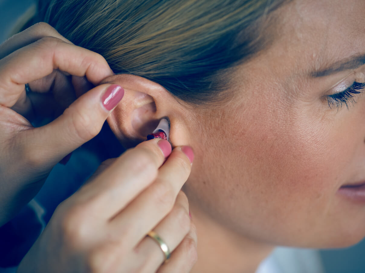 inserting invisible hearing aids